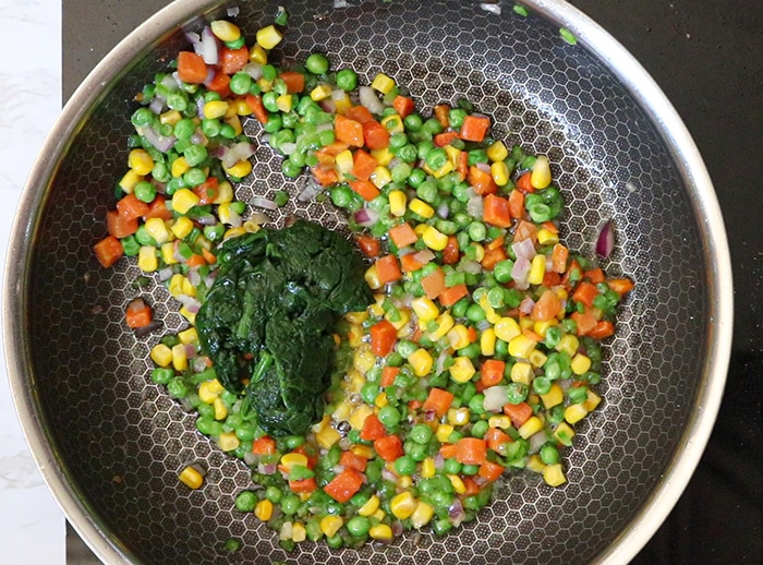 Add blanched spinach
