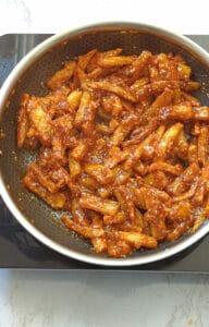 toss the potatoes in sauce