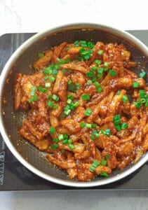 Garnish and serve hot