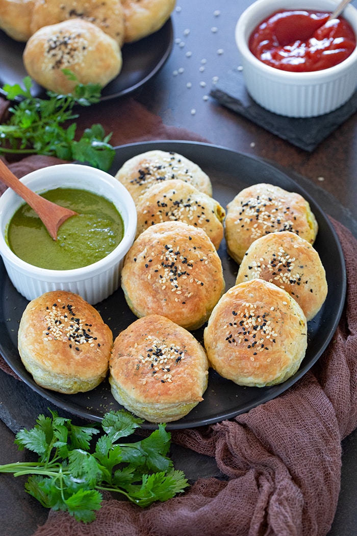 Spicy Paneer Patties on a plate with green chutney