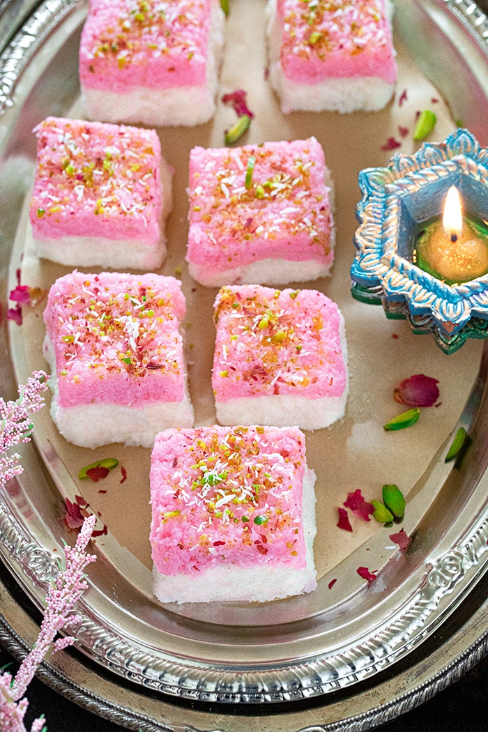 Rose-flavored Coconut burfi on a plate