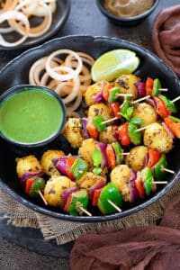 Tandoori aloo tikka on toothpick served as a platter